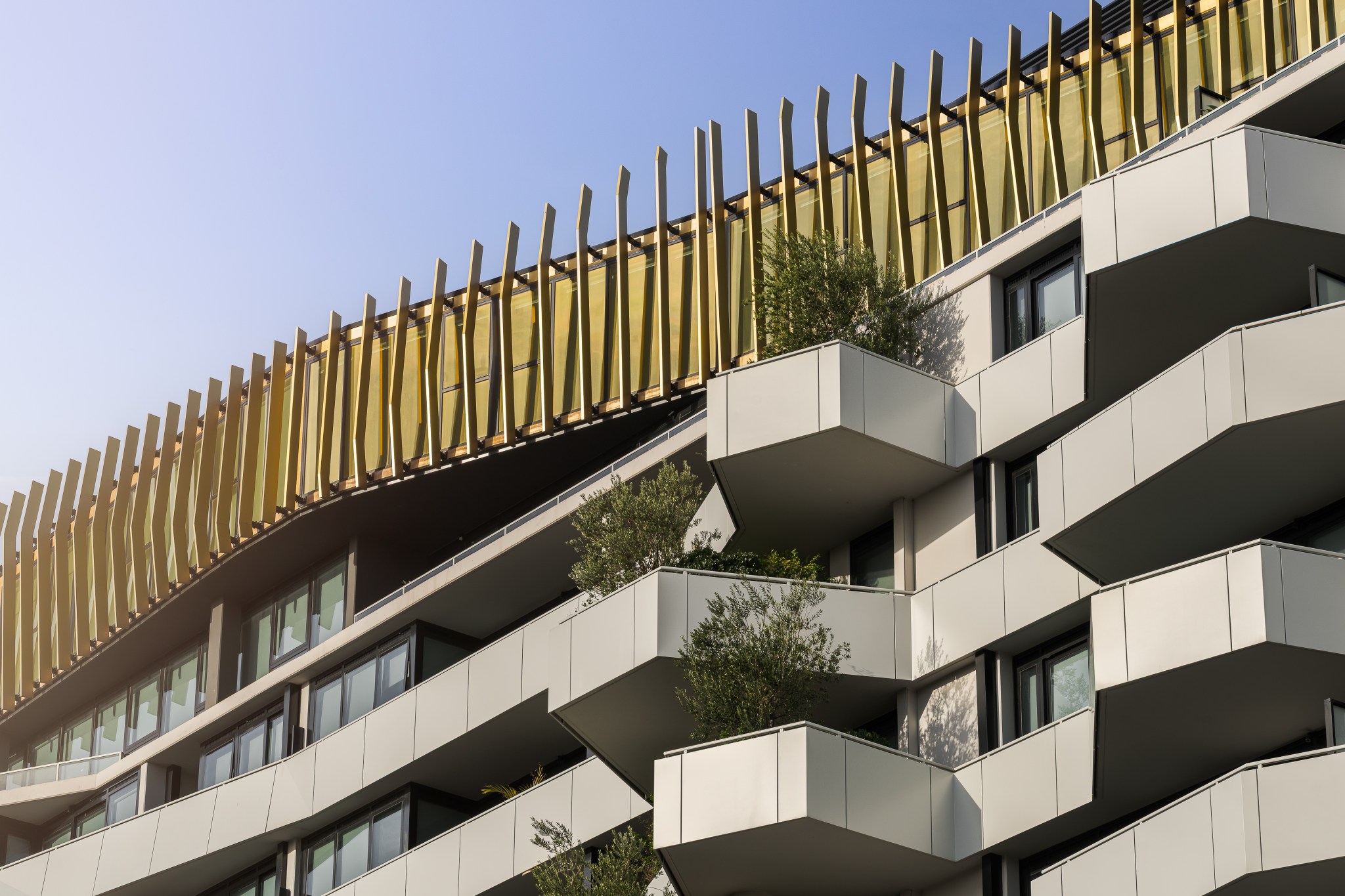 Multi-residential facade with gold fins and balconies in Melbourne